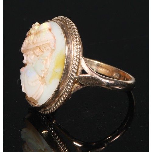 143 - A 9ct gold carved opal and quartz cameo ring, size O, marked 375, 5g; a 9ct gold carved shell cameo ... 