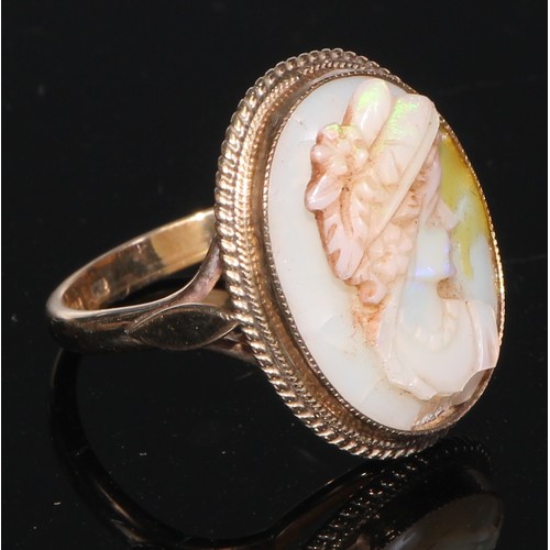 143 - A 9ct gold carved opal and quartz cameo ring, size O, marked 375, 5g; a 9ct gold carved shell cameo ... 