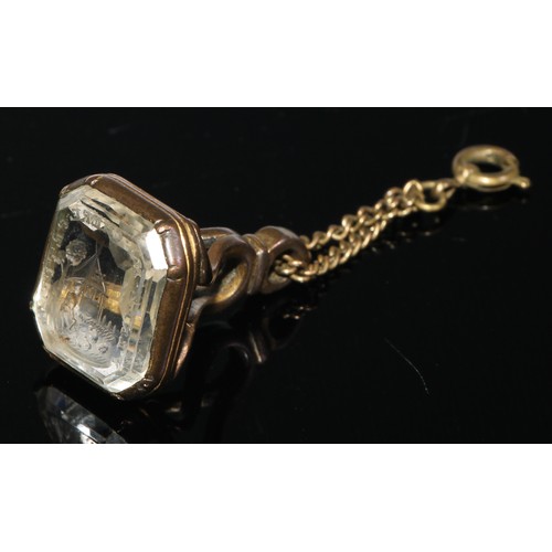 239 - A yellow metal fob seal, set with a shaped rectangular intaglio rock crystal, engraved with a young ... 