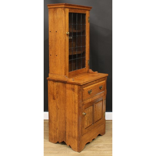 113 - Christopher Milner, Fine Woodcraft of Alfreton - an oak display or bookcase cabinet, moulded cornice... 