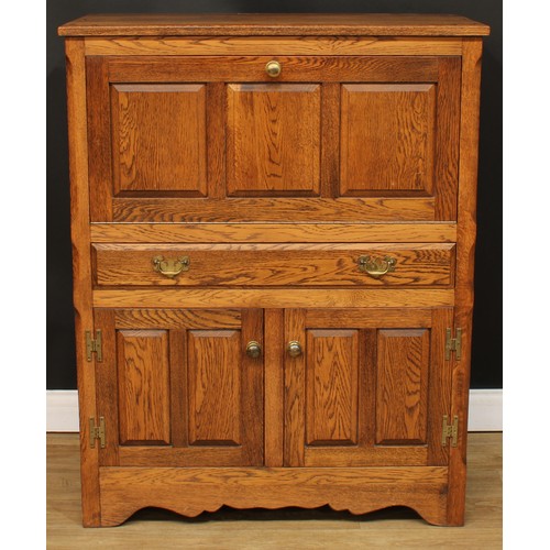 114 - Andrew Sharpe, Fine Oak Furniture of Matlock - an oak side cabinet, 119cm high, 94cm wide, 48cm deep