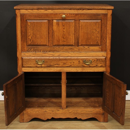 114 - Andrew Sharpe, Fine Oak Furniture of Matlock - an oak side cabinet, 119cm high, 94cm wide, 48cm deep