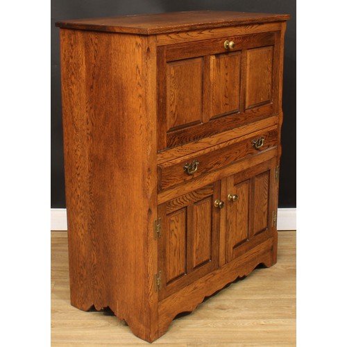 114 - Andrew Sharpe, Fine Oak Furniture of Matlock - an oak side cabinet, 119cm high, 94cm wide, 48cm deep