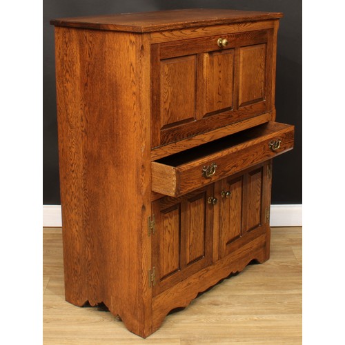 114 - Andrew Sharpe, Fine Oak Furniture of Matlock - an oak side cabinet, 119cm high, 94cm wide, 48cm deep