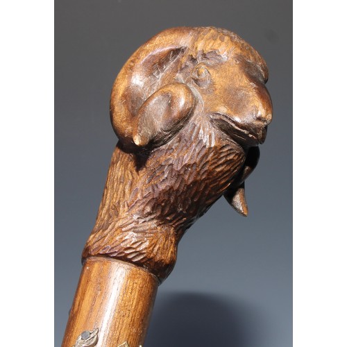 305 - A novelty walking stick, the softwood handle carved as a dogs head and neck, 91cm long; another, the... 