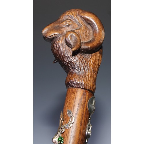 305 - A novelty walking stick, the softwood handle carved as a dogs head and neck, 91cm long; another, the... 