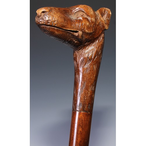 305 - A novelty walking stick, the softwood handle carved as a dogs head and neck, 91cm long; another, the... 