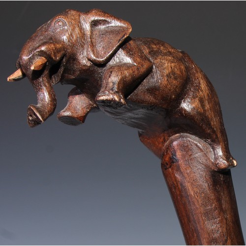 305 - A novelty walking stick, the softwood handle carved as a dogs head and neck, 91cm long; another, the... 