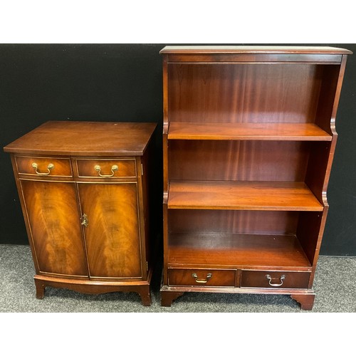 74 - A mahogany waterfall bookcase, three tiers of shelving above pair of drawers to base, 122cm tall x 7... 