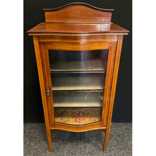 250 - An Edwardian inlaid mahogany serpentine display cabinet, arched back, over sailing top, glazed singl... 