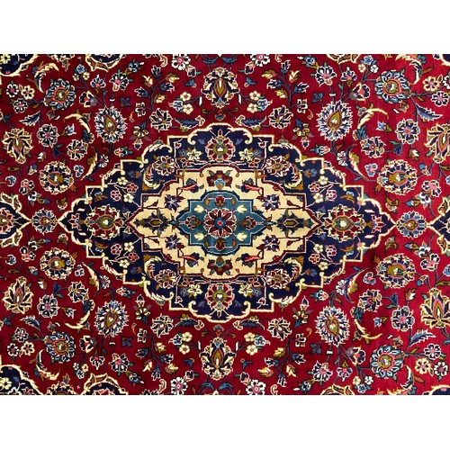 285 - A central Persian Kashan rug / carpet, 320cm x 205cm.