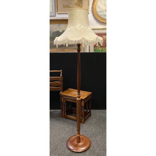 311 - An early 20th century mahogany standard lamp;  an oak wall mountable display cabinet, serpentine top... 