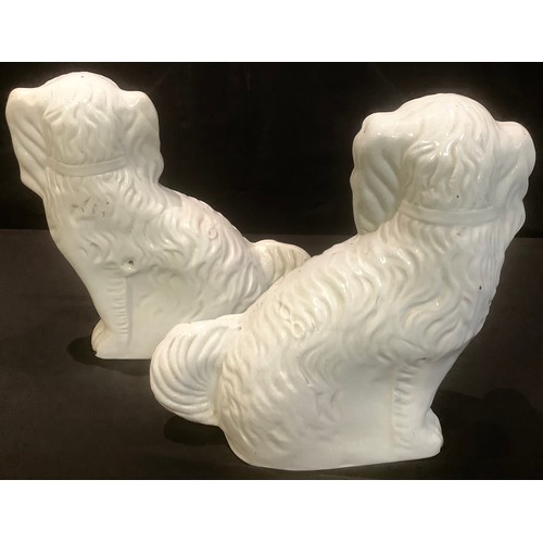 66 - A pair of Victorian Staffordshire mantle dogs, 30cm high