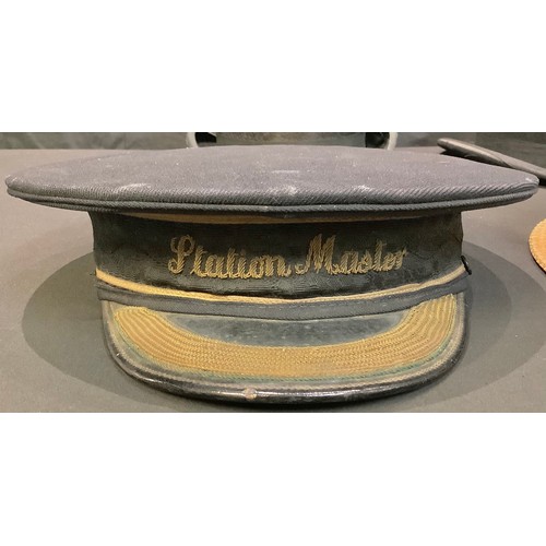 74 - A Victorian railway Station Master cap, embroidered in gold braid; a moleskin top hat, J. H. Millson... 