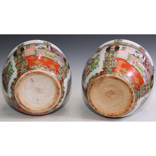 121 - A pair of Chinese famille rose fish bowls, hardwood stands, 48.5cm high on stand, 31.5cm diameter (2... 