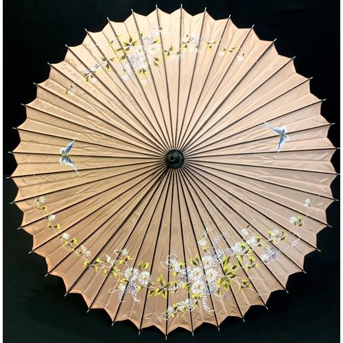 125 - An early 20th century Chinese paper umbrella, c.1920; others, painted textile umbrellas; late Victor... 