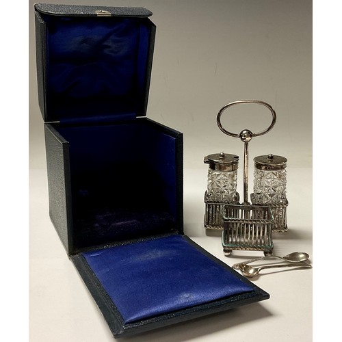 252 - A silver cruet stand, Sheffield 1895; two silver topped cruet bottles, London 1895; silver salt spoo... 