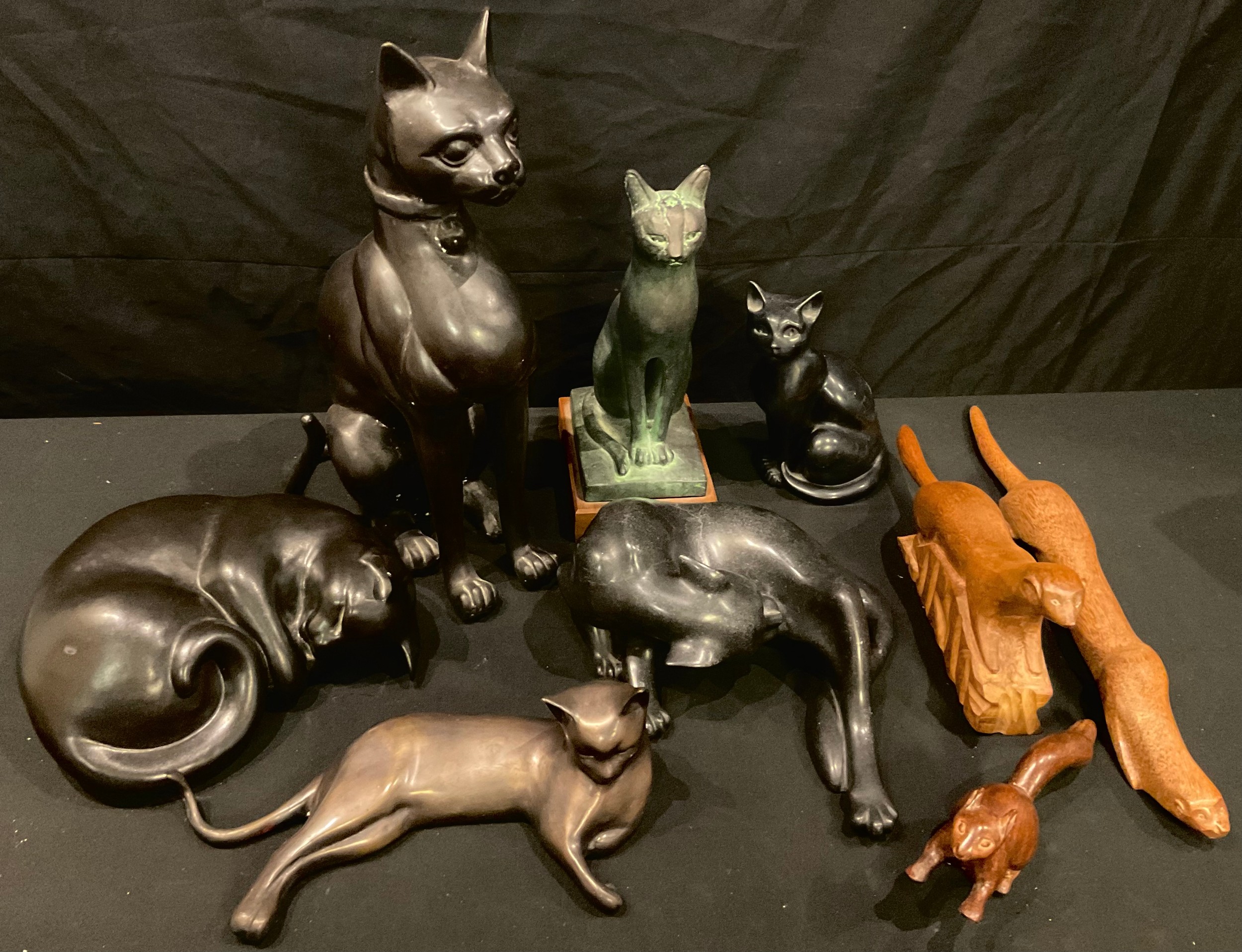 A bronzed model of a reclining cat auctions & price archive
