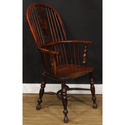 110 - A 19th century yew and elm primary Windsor elbow chair, 108cm high, 57cm wide, the seat 41cm wide an... 