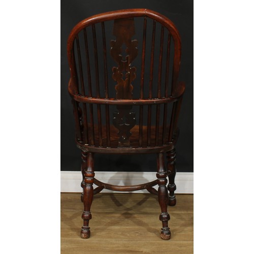 110 - A 19th century yew and elm primary Windsor elbow chair, 108cm high, 57cm wide, the seat 41cm wide an... 