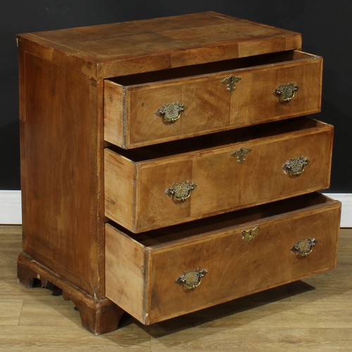 115 - A George II Revival featherbanded walnut caddy top chest, of three long drawers, 75.5cm high, 75cm w... 