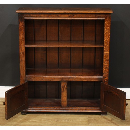 202 - An oak bookcase, probably Titchmarsh & Goodwin, 96cm high, 84cm wide, 26cm deep