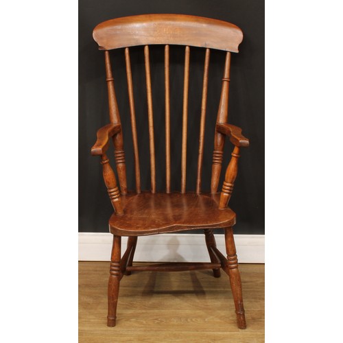 715 - A beech and elm elbow chair, 101cm high, 52.5cm wide, the seat 32cm wide and 38cm deep; an Old Charm... 