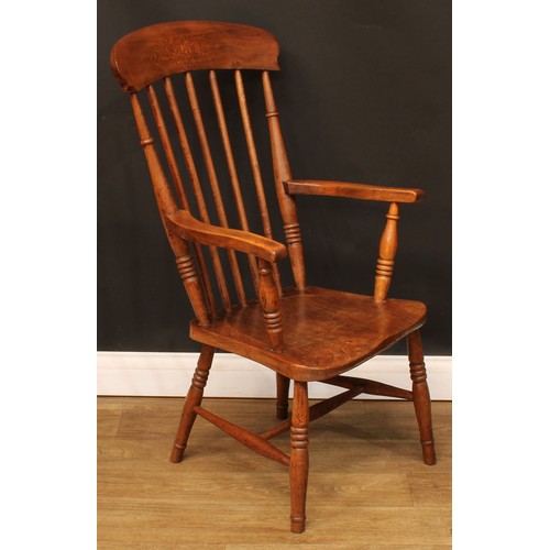 715 - A beech and elm elbow chair, 101cm high, 52.5cm wide, the seat 32cm wide and 38cm deep; an Old Charm... 