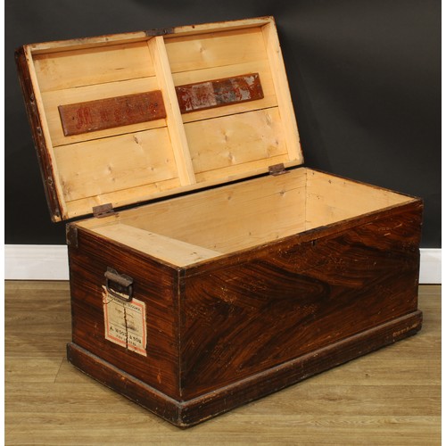 716 - A pine chest, hinged cover enclosing a till, the sides scumbled, carry handles to sides, paper label... 