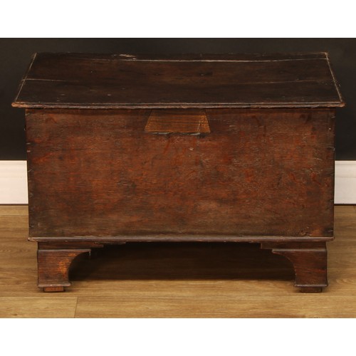 720 - An oak plank chest, hinged cover, 47cm high, 74cm wide, 44.5cm deep