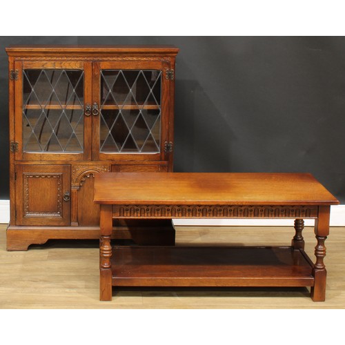 721 - An oak side cabinet, 102.5cm high, 84.5cm wide, 26cm deep; a similar coffee table, 45cm high, 102cm ... 