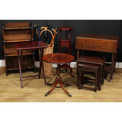 728 - An oak waterfall bookcase; an oak serving trolley; washstand; low table; folding table; a graduated ... 