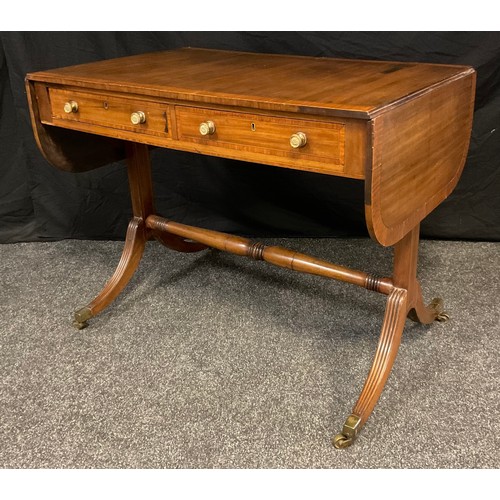 16 - A late 19th century regency style mahogany sofa table, rectangular top, with D-shaped drop ends, pai... 