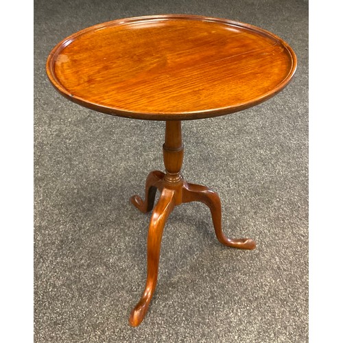 24 - A 19th century mahogany wine table, circular tilt top, 49.5cm diameter, turned column, tripod feet, ... 