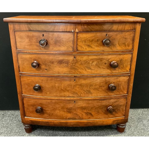 27 - A Victorian mahogany bow-front chest of drawers, two short over three graduated long drawers, turned... 