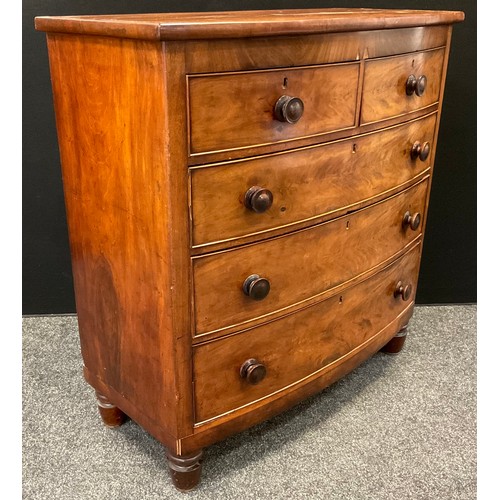 27 - A Victorian mahogany bow-front chest of drawers, two short over three graduated long drawers, turned... 