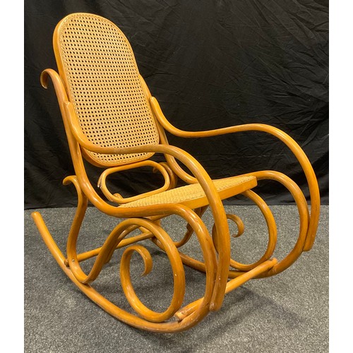 30 - A Thonet style bentwood rocking chair, mid 20th century.