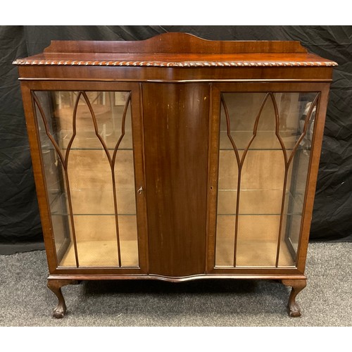 35 - An Edwardian mahogany china display cabinet, serpentine top with gadrooned border, pair of glazed do... 