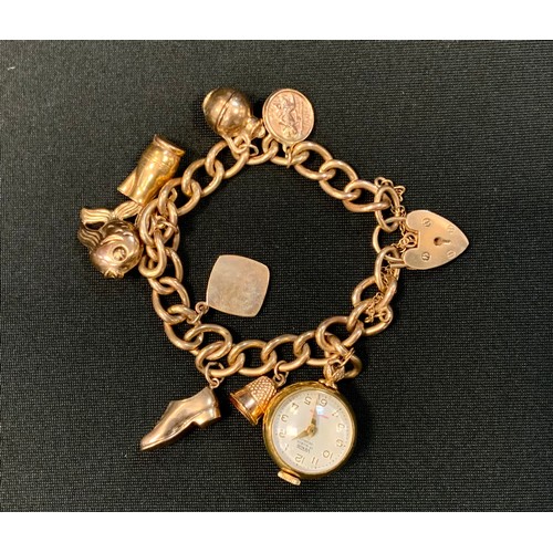 348 - A 9ct gold and yellow metal charm bracelet, set with eight charms inc Venus 20 micron gold plated wa... 