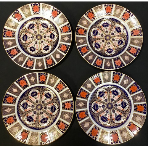 4 - A set of four Royal Crown Derby 1128 pattern dinner plates, second quality