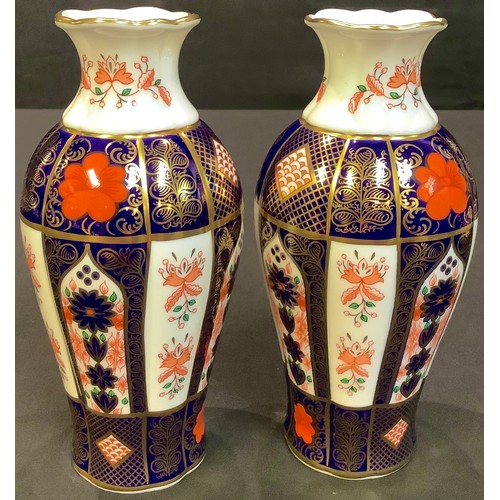 17 - A pair of Royal Crown Derby 1128 pattern baluster vases, 18cm high (2)