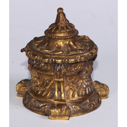 26 - A 19thC ormolu inkwell, cast overall with masks and swags, scroll feet, 8.5cm high, c.1870 (lacks gl... 