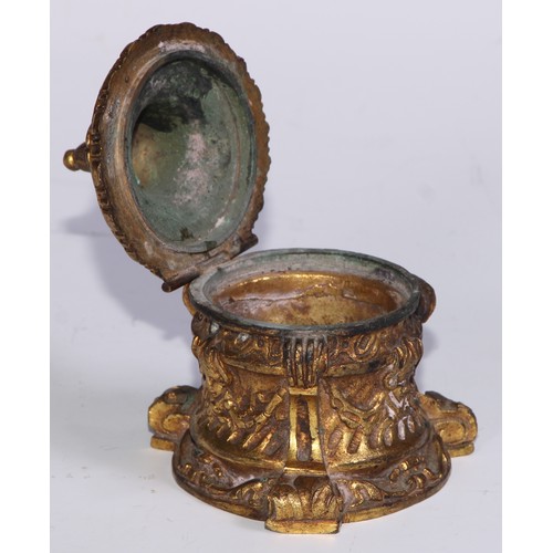 26 - A 19thC ormolu inkwell, cast overall with masks and swags, scroll feet, 8.5cm high, c.1870 (lacks gl... 