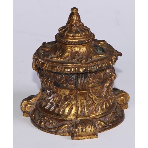 26 - A 19thC ormolu inkwell, cast overall with masks and swags, scroll feet, 8.5cm high, c.1870 (lacks gl... 