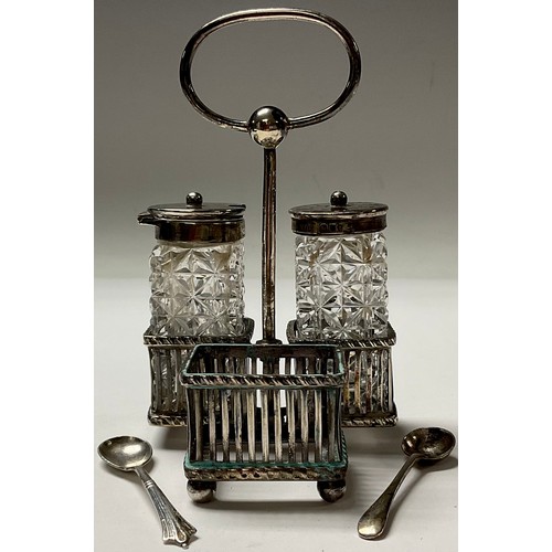 33 - A silver cruet stand, Sheffield 1895; two silver topped cruet bottles, London 1895; silver salt spoo... 