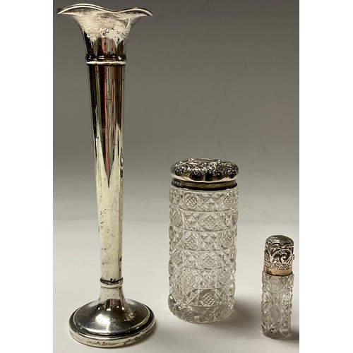 34 - A Victorian hallmarked silver topped scent bottle, Birmingham 1886; a silver topped jar; a specimen ... 