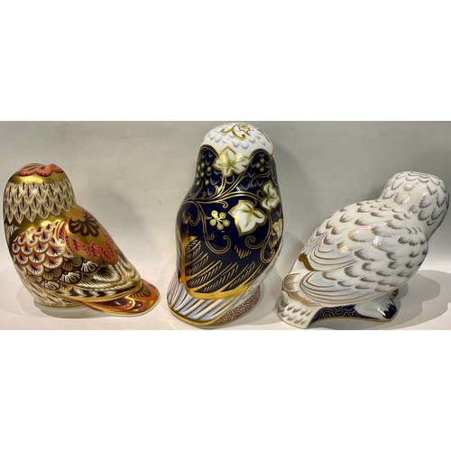 39 - A Royal Crown Derby paperweight, Twilight Owl, gold stopper, printed mark; two others, Snowy Owl and... 