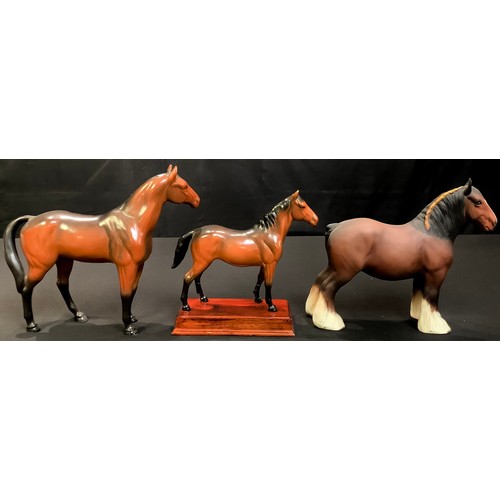 54 - A Beswick model of a Shire Horse, matt glaze, 21cm high, printed mark; a Sylvac model of a horse and... 