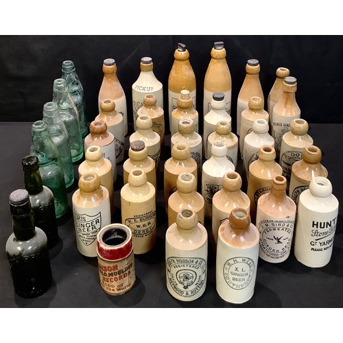 61 - Advertising Bottles - stoneware ginger beer bottles including W. E. Burrows, Derby; W.Simpson, Walkd... 