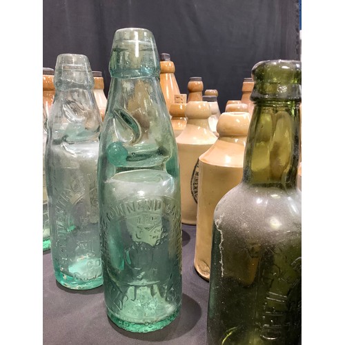 61 - Advertising Bottles - stoneware ginger beer bottles including W. E. Burrows, Derby; W.Simpson, Walkd... 